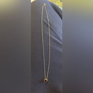 14k gold necklace with bezel-set solitary garnet stone